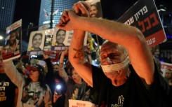 Relatives and supporters of hostages seized by Gaza militants during the October 7 attacks rally in Tel Aviv for their release