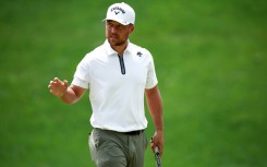 Xander Schauffele fired a four-under par 67 to grab the lead at the storm-hit PGA Wells Fargo Championship