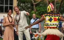 The couple were greeted at a school in Abuja by a drum and dance group from the Igbo ethnic group