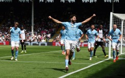Manchester City defender Josko Gvardiol (C) celebrates scoring against Fulham