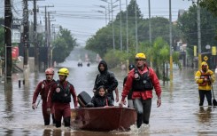 Firefighters rescue locals in a boat, at Santos Dumont neighbourhood in Sao Leopoldo, Rio Grande do Sul, Brazil, on May 12, 2024