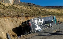 The bus was traveling from Lima to the city of Ayacucho when it rolled down a ledge, landing upside down