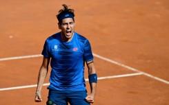 Alejandro Tabilo celebrates after winning against China's Zhang Zhizhen in the Rome Open quarter-finals