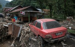 Flash floods and cold lava flow from a volcano hit several districts in western Indonesia