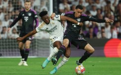 Real Madrid's French midfielder Aurelien Tchouameni (L) is not completely ruled out from returning for the final