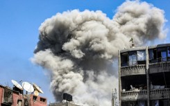 A smoke plume rises during Israeli bombardment in Jabalia in the northern Gaza Strip on May 14, 2024 