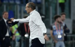 Juventus coach Massimiliano Allegri tosses away his tie after seeing red during his side's 1-0 victory against Atalanta in the Italian Cup final