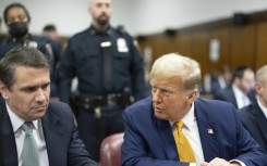 Former US President Donald Trump, with lawyer Todd Blanche (L) attends his ongoing criminal trial in Manhattan