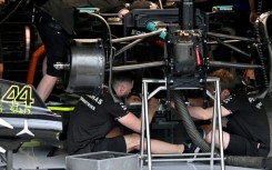 Work it out: Mechanics work on the Mercedes of Lewis Hamilton