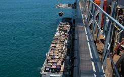 US CENTCTOM picture shows Gaza-bound aid lifted by crane at the Ashdod port in southern Israel