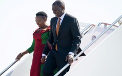 Kenyan President William Ruto and his wife, First Lady Rachel Ruto, disembark from their airplane on arrival in Washington