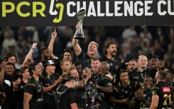 Triumph: Sharks players celebrate with the trophy after their European Challenge Cup final win over Gloucester at the Tottenham Hotsour Stadium