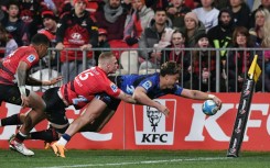 Blues winger AJ Lam scores a try but the Canterbury Crusaders fought back to score an upset 29-27 win in a Super Rugby Pacific quarter-final