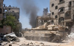 A handout picture released by the Israeli army showing an Israeli tank during operations in the Gaza Strip