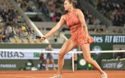 Fightback: Aryna Sabalenka plays a backhand return to Paula Badosa