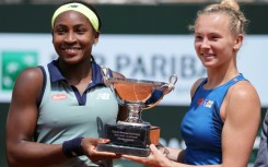 Coco Gauff (L) has now won Grand Slam titles in both singles and doubles at the age of just 20