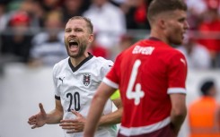Austria's midfielder Konrad Laimer (L) and Switzerland defender Nico Elvedi featured at the Kybunpark