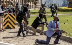 Kenya Police officers and security personnel take positions at the Kenyan Parliament