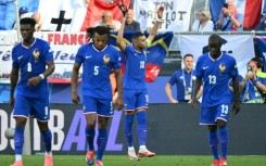 Kylian Mbappe removed his mask to celebrate scoring a penalty to put France ahead but they were frustrated by Poland