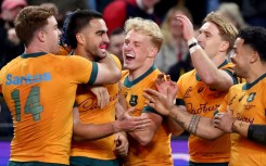 Australia celebrate after beating Wales 25-16