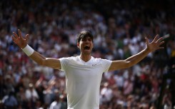 Carlos Alcaraz celebrates beating Novak Djokovic to retain his Wimbledon title