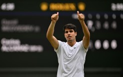 Defending champion Carlos Alcaraz celebrates reaching the Wimbledon final