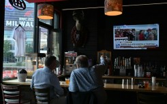 Milwaukee residents watch news of the assassination attempt on Donald Trump at a bar
