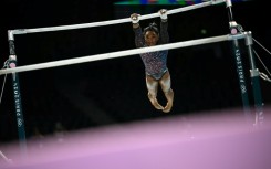 Four-time Olympic gold medallist Simone Biles trains on uneven bars in the run-up to the Paris Games