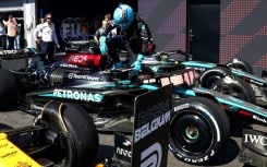 George Russell steps out of his car after taking the chequered flag at the Belgian Grand Prix only to discover later that it was underweight prompting his disqualification 
