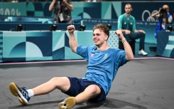 Sweden's Truls Moregard celebrates after winning against China's Wang Chuqin 