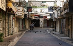 Shops are shuttered in the West Bank city of Nablus as Palestinian observe a general strike in protest at the killing of Hamas leader Isamail Haniyeh in an air strike in Tehran