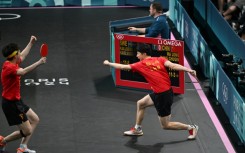 Ma Long (R) wins a point in the men's team final in Paris