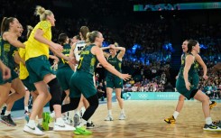 Australia players celebrate after beating Belgium for Olympic basketball bronze