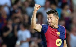 Barcelona's Polish forward Robert Lewandowski celebrates scoring his team's second goal against Athletic
