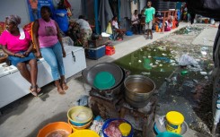 Vendors sell soup near a displacement camp in Port-au-Prince, Haiti in August 2024