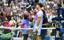 Frances Tiafoe and Ben Shelton shake hands after Tiafoe's victory in their all-American US Open third-round match