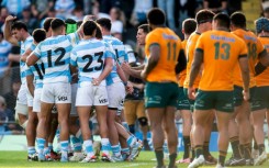 Argentina's players celebrate after scoring their fourth try against Australia in Santa Fe