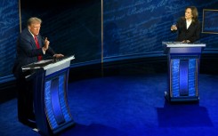 US Vice President and Democratic presidential candidate Kamala Harris (R) and former US President and Republican presidential candidate Donald Trump speak during a presidential debate in Philadelphia, Pennsylvania, on September 10, 2024
