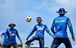 Sri Lanka's captain Dhananjaya De Silva (C) plays football during a practice session ahead of the first Test against New Zealand