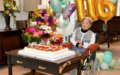 A handout photo taken on May 23, 2024  by the Ashiya City government shows Tomiko Itook, ebelieved to be the world's oldest living person, celebrating her 116th birthday