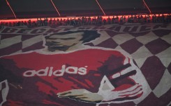 Bayern Munich fans display a banner depicting late football player Franz Beckenbauer at their Allianz Arena home