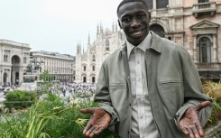 Khaby Lame's trademark gesture -- palms skywards and a knowing smile