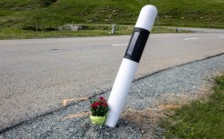 Fans laid flowers by the curve where  Gino Maeder suffered a fatal fall  during a high-speed descent on the Tour of Switzerland in 2023