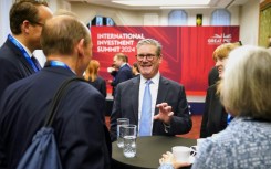 The prime minister mingled with business leaders, but many big names were absent from the summit