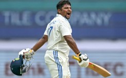 India's Sarfaraz Khan celebrates after scoring a century on the fourth day of the first cricket Test against New Zealand in Bengaluru
