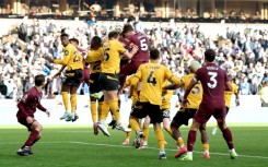 Manchester City's John Stones rises to score the winner against Wolves