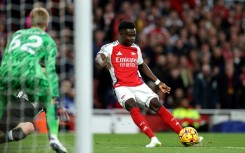 On target: Arsenal midfielder Bukayo Saka pictured scoring the Gunners' opening goal in a 2-2 draw with Liverpool 