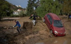 Emergency services rescued scores of people in Alora in Andalusia in southern Spain after a river overflowed.