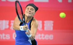 Russia's Diana Shnaider hits a return to Britain's Katie Boulter 