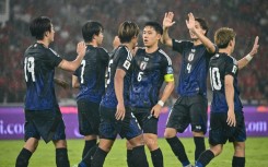 Japan hammered a hapless Indonesia side 4-0 on Friday, extending their lead at the top of qualifying for the 2026 World Cup